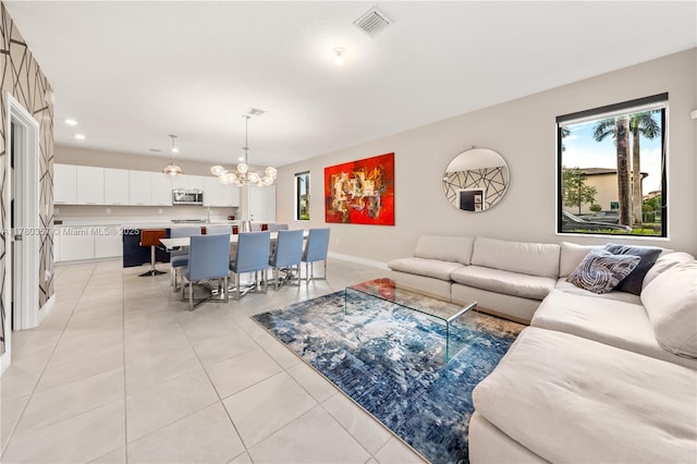 4641 NW 83rd Pkwy Unit 4641, Doral, FL 33166 - living area with light tile patterned floors, visible vents, recessed lighting, baseboards, and a notable chandelier