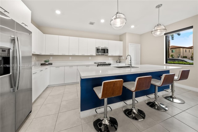 4641 NW 83rd Pkwy Unit 4641, Doral, FL 33166 - kitchen featuring visible vents, light tile patterned floors, a sink, light countertops, and appliances with stainless steel finishes