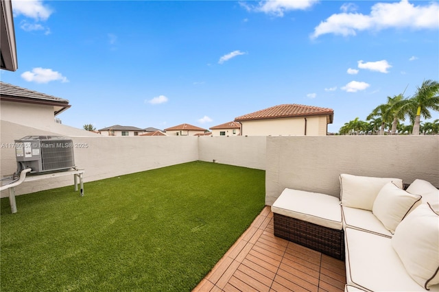 4641 NW 83rd Pkwy Unit 4641, Doral, FL 33166 - view of yard featuring central AC unit, a fenced backyard, and outdoor lounge area