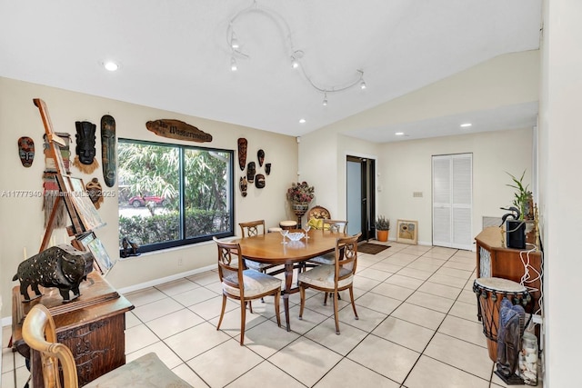 dining space with baseboards, recessed lighting, light tile patterned floors, and vaulted ceiling