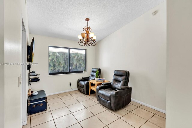 14811 Archerhall St, Davie, FL 33331 - sitting room featuring a chandelier, a textured ceiling, and light tile patterned floors