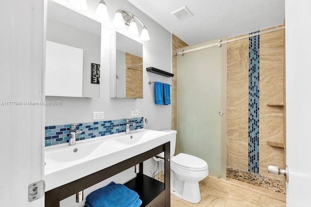 full bath with visible vents, backsplash, toilet, and a shower stall