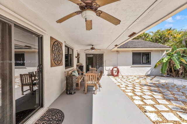 view of patio with ceiling fan