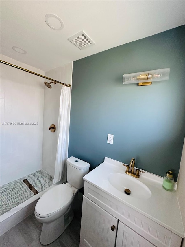 full bath with a shower stall, visible vents, toilet, and vanity