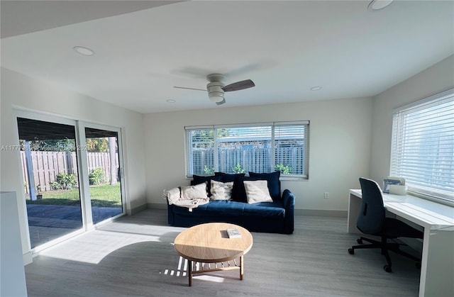 interior space with wood finished floors, baseboards, recessed lighting, and ceiling fan