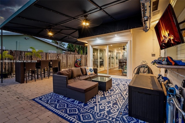 view of patio / terrace with outdoor dry bar, fence, and an outdoor hangout area