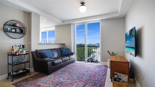 2400 SW 27th Ave Unit 706, Miami, FL 33145 - living room featuring tile patterned flooring and baseboards