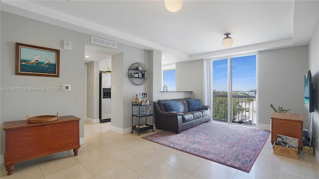 2400 SW 27th Ave Unit 706, Miami, FL 33145 - living room with baseboards and light tile patterned floors