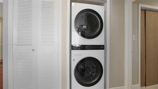 2400 SW 27th Ave Unit 706, Miami, FL 33145 - laundry room featuring stacked washing machine and dryer