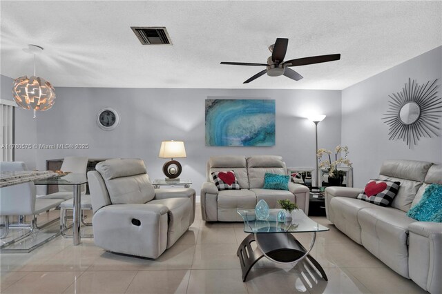 14723 SW 86th Ln, Miami, FL 33193 - living area with ceiling fan, a chandelier, a textured ceiling, and light tile patterned flooring