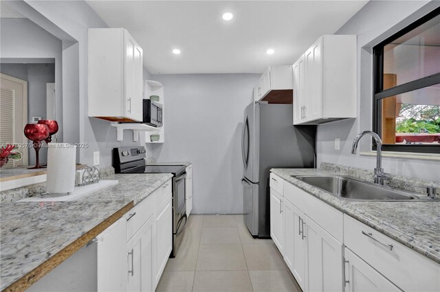 14723 SW 86th Ln, Miami, FL 33193 - kitchen featuring stainless steel appliances, white cabinetry, recessed lighting, and light tile patterned flooring