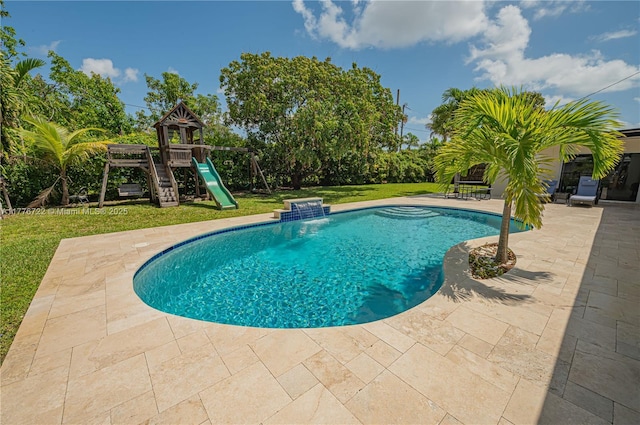1901 NE 186th Dr, North Miami Beach, FL 33179 - outdoor pool with a yard, a playground, and a patio area