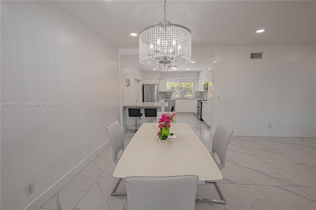 1901 NE 186th Dr, North Miami Beach, FL 33179 - dining room featuring baseboards, recessed lighting, a notable chandelier, and marble finish floor