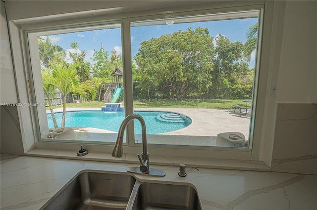 1901 NE 186th Dr, North Miami Beach, FL 33179 - room details with a sink and light stone counters
