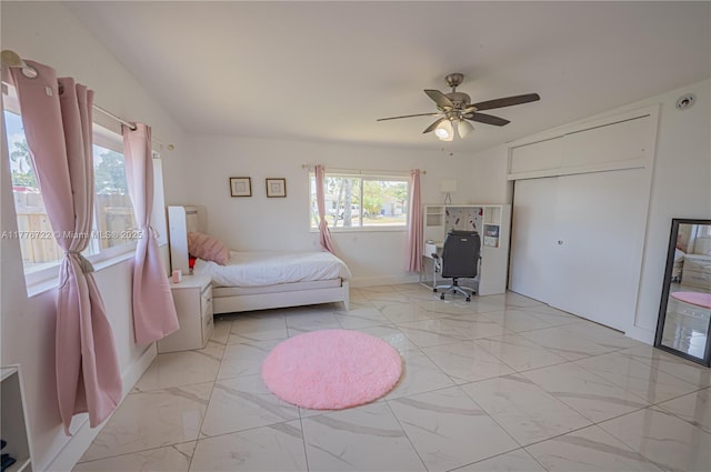 1901 NE 186th Dr, North Miami Beach, FL 33179 - bedroom with marble finish floor, a ceiling fan, and baseboards