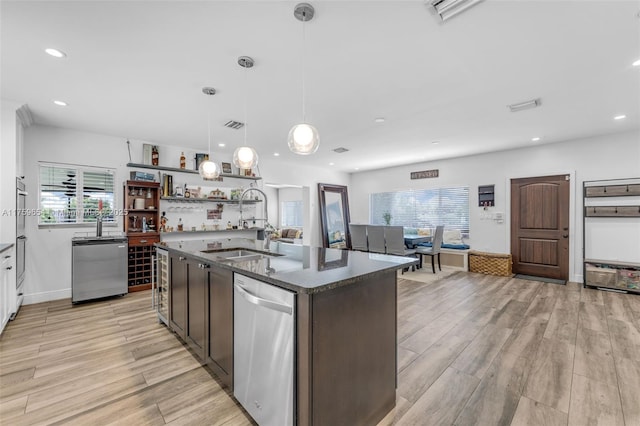 19050 SW 144th Ave, Miami, FL 33177 - kitchen featuring dishwashing machine, a sink, plenty of natural light, recessed lighting, and light wood-style flooring