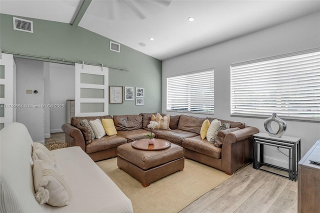 19050 SW 144th Ave, Miami, FL 33177 - living area featuring a barn door, light wood-style flooring, recessed lighting, and a ceiling fan