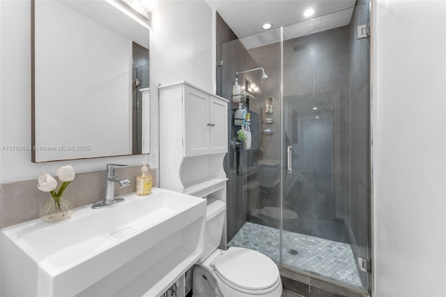 19050 SW 144th Ave, Miami, FL 33177 - bathroom featuring toilet, a shower stall, vanity, and recessed lighting