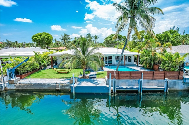 2243 Bayview Ln, North Miami, FL 33181 - dock area featuring fence, an outdoor pool, a patio area, a lawn, and a water view