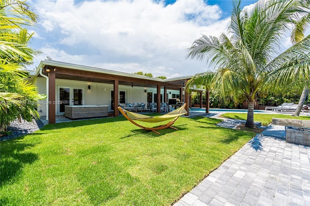 2243 Bayview Ln, North Miami, FL 33181 - exterior space featuring a swimming pool, a patio, a jacuzzi, and a yard