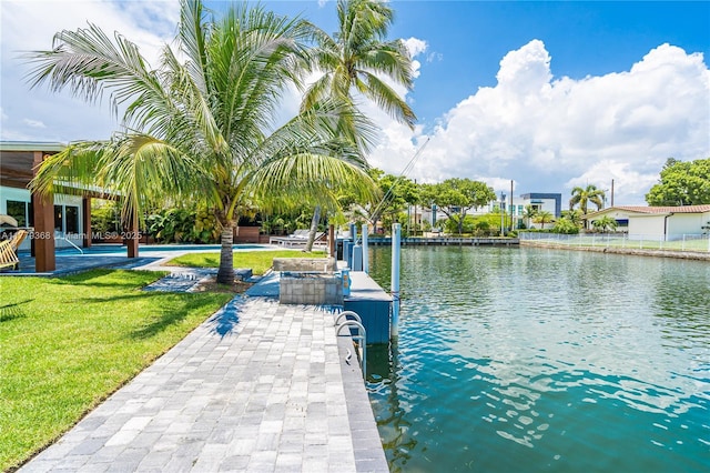 2243 Bayview Ln, North Miami, FL 33181 - dock area featuring a lawn and a water view