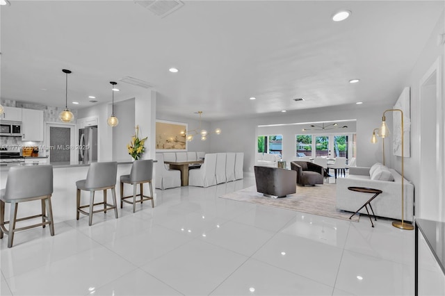 2243 Bayview Ln, North Miami, FL 33181 - living room with recessed lighting, visible vents, and french doors