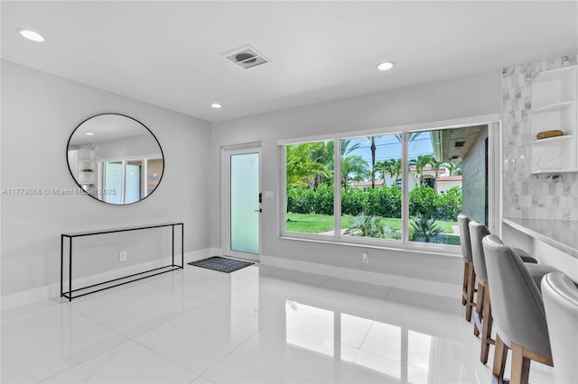 2243 Bayview Ln, North Miami, FL 33181 - entrance foyer with tile patterned floors, baseboards, recessed lighting, and visible vents