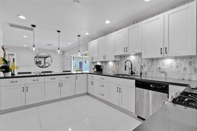 2243 Bayview Ln, North Miami, FL 33181 - kitchen with dark countertops, tasteful backsplash, dishwasher, a sink, and recessed lighting
