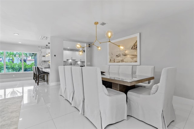 2243 Bayview Ln, North Miami, FL 33181 - dining room featuring baseboards, a notable chandelier, light tile patterned flooring, and visible vents