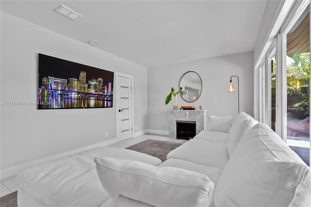 2243 Bayview Ln, North Miami, FL 33181 - tiled living area featuring baseboards, visible vents, and a high end fireplace