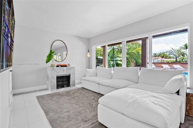 2243 Bayview Ln, North Miami, FL 33181 - tiled living room featuring baseboards and a premium fireplace