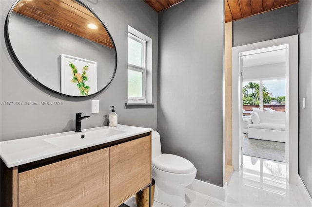 2243 Bayview Ln, North Miami, FL 33181 - bathroom featuring vanity, baseboards, tile patterned flooring, and toilet
