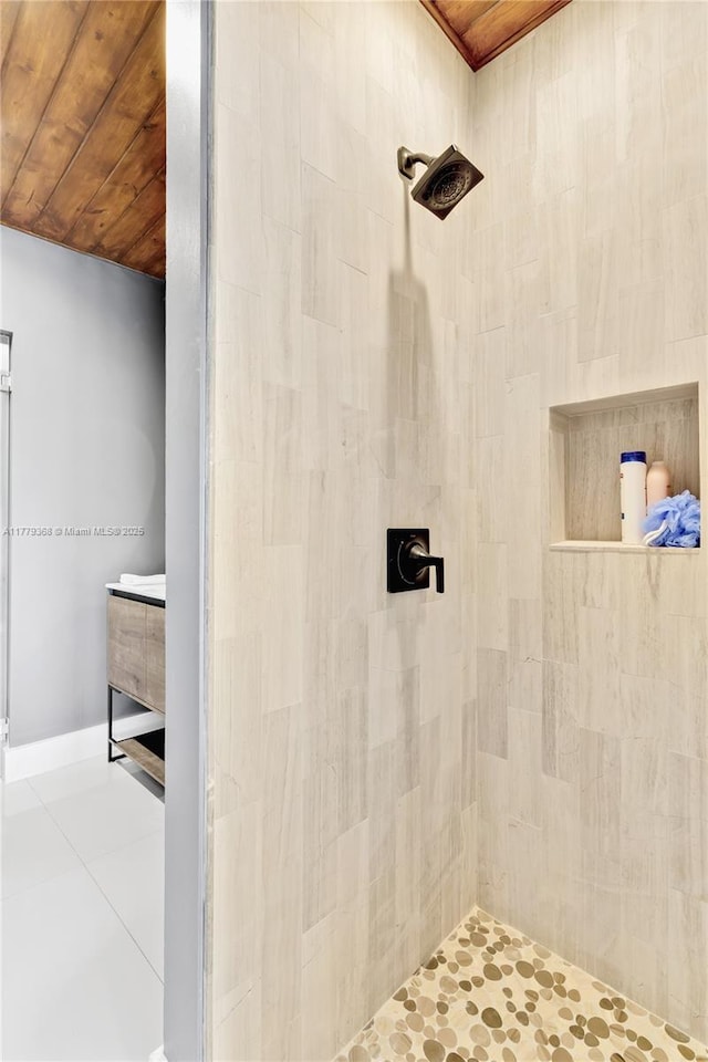 2243 Bayview Ln, North Miami, FL 33181 - full bathroom featuring tile patterned floors, a tile shower, and wood ceiling