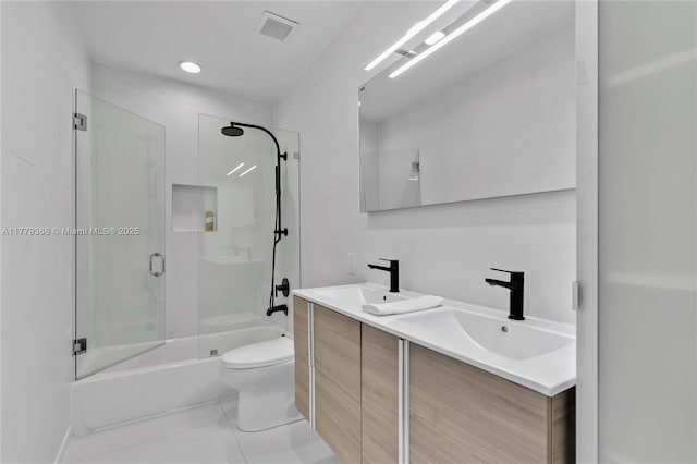 2243 Bayview Ln, North Miami, FL 33181 - bathroom featuring double vanity, toilet, visible vents, and a sink