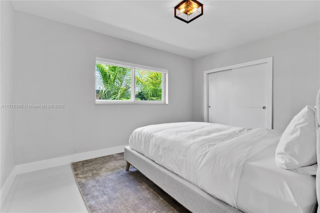 2243 Bayview Ln, North Miami, FL 33181 - bedroom featuring baseboards and a closet