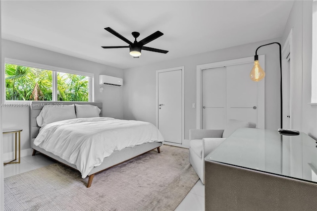 2243 Bayview Ln, North Miami, FL 33181 - tiled bedroom with an AC wall unit and a ceiling fan