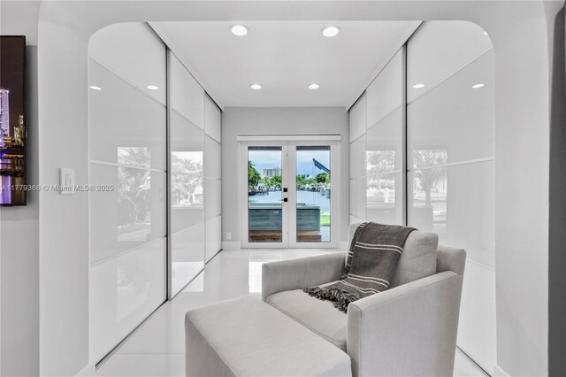 2243 Bayview Ln, North Miami, FL 33181 - living area featuring french doors, arched walkways, and recessed lighting