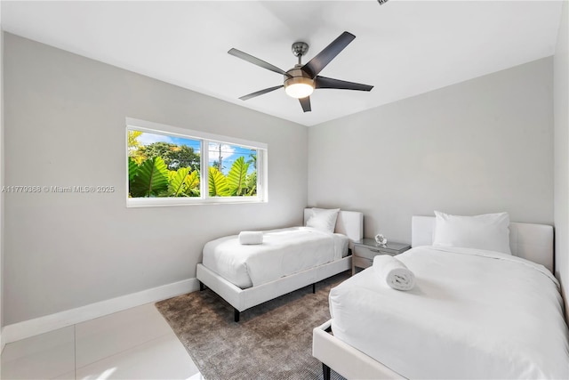 2243 Bayview Ln, North Miami, FL 33181 - bedroom featuring a ceiling fan and baseboards