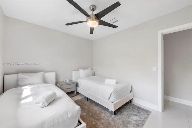 2243 Bayview Ln, North Miami, FL 33181 - tiled bedroom with baseboards, a ceiling fan, and visible vents