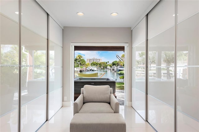 2243 Bayview Ln, North Miami, FL 33181 - sitting room featuring recessed lighting, a water view, and tile patterned floors