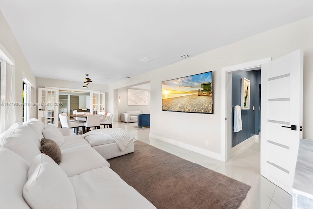 2243 Bayview Ln, North Miami, FL 33181 - living area featuring french doors, baseboards, light tile patterned flooring, and visible vents