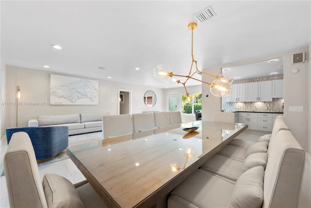 2243 Bayview Ln, North Miami, FL 33181 - dining room with visible vents, recessed lighting, light tile patterned floors, and an inviting chandelier