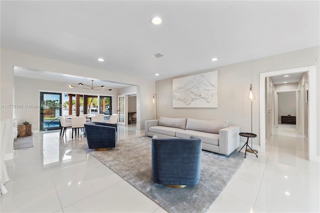 2243 Bayview Ln, North Miami, FL 33181 - living area with light tile patterned floors, baseboards, recessed lighting, and visible vents