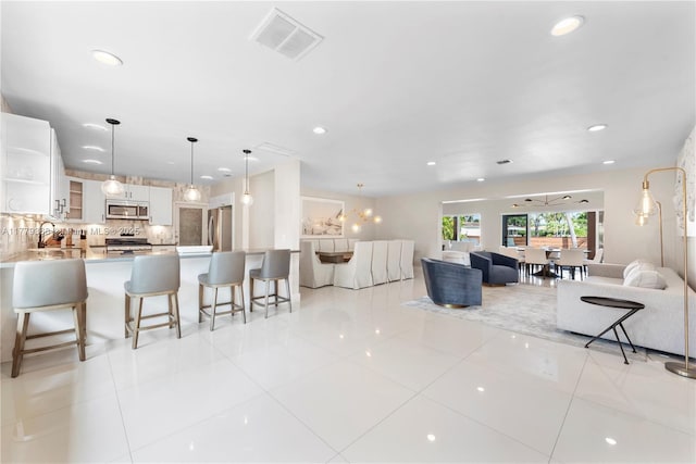 2243 Bayview Ln, North Miami, FL 33181 - living area featuring visible vents, recessed lighting, and light tile patterned floors