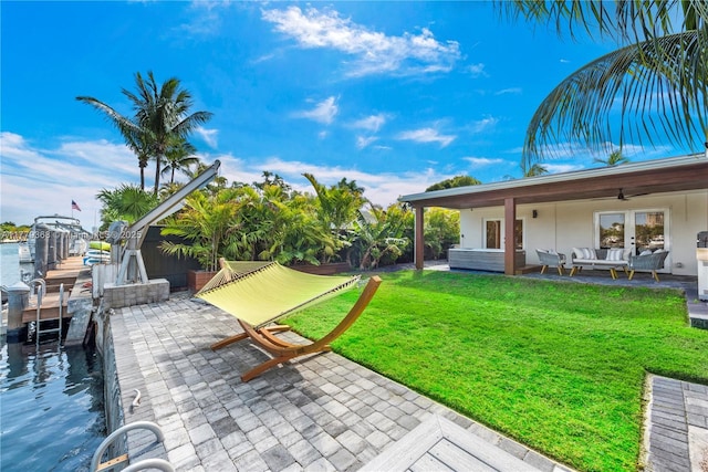 2243 Bayview Ln, North Miami, FL 33181 - exterior space with an outdoor living space and a boat dock