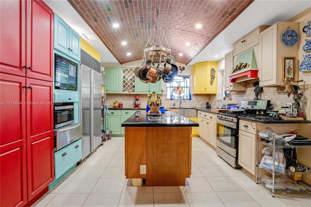 19341 Holiday Rd, Cutler Bay, FL 33157 - kitchen featuring built in appliances, a warming drawer, vaulted ceiling, a kitchen island, and recessed lighting