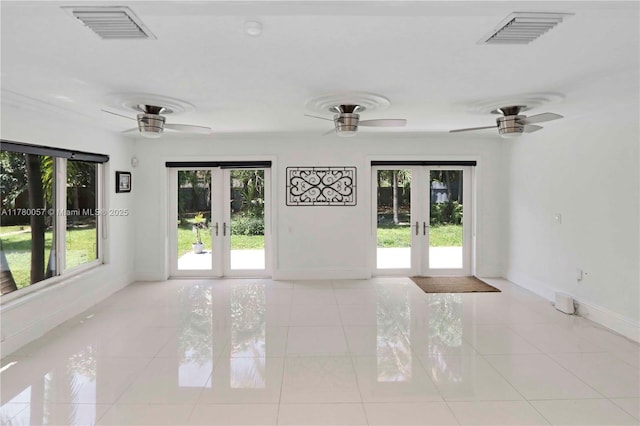 13130 NW 1st Ave, Miami, FL 33168 - empty room with french doors, baseboards, a ceiling fan, and light tile patterned floors
