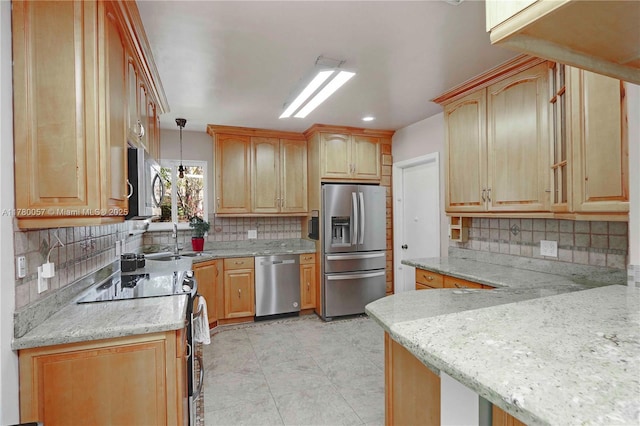 kitchen with light stone countertops, light brown cabinetry, a sink, stainless steel appliances, and backsplash