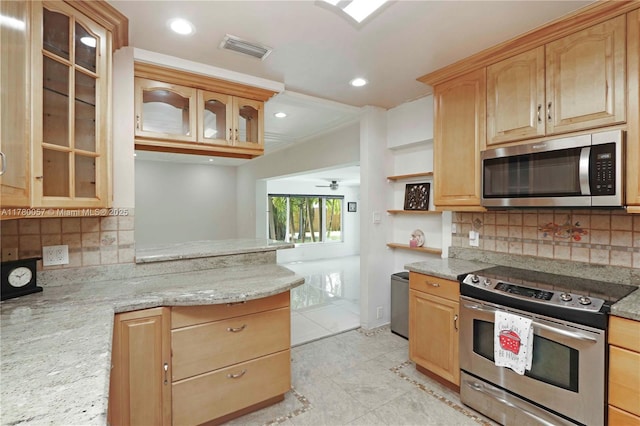 13130 NW 1st Ave, Miami, FL 33168 - kitchen with stainless steel appliances, light brown cabinetry, light stone countertops, tasteful backsplash, and recessed lighting