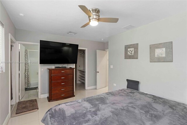 walk in closet featuring tile patterned flooring